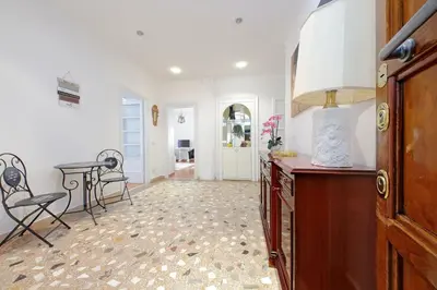 a kitchen with a table and chairs in a room at 4BNB - Annibaliano Metro Apartment in Rome