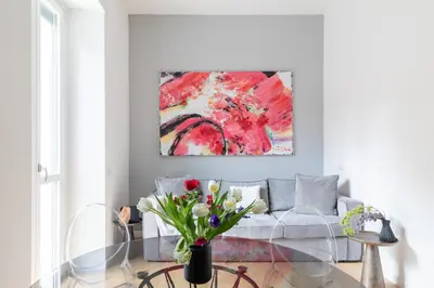 a living room with a couch and a painting on the wall at iFlat Stylish & Cozy Vatican Peaceful Gem in Rome