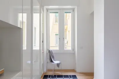 a room with a chair and a window at iFlat Stylish & Cozy Vatican Peaceful Gem in Rome