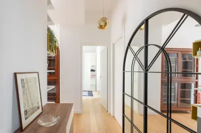 a room with a glass door and a table at iFlat Stylish & Cozy Vatican Peaceful Gem in Rome
