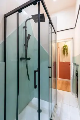 a shower in a bathroom with a glass door at The 38 Home Exclusive - Homkeey Apartments in Rome