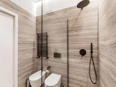 a bathroom with a toilet and a shower at The Best Rent - Prestigious multi-bedroom apartment overlooking St. Peter’s in Rome