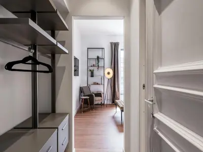 a hallway with a kitchen and a living room at The Best Rent - Prestigious multi-bedroom apartment overlooking St. Peter’s in Rome