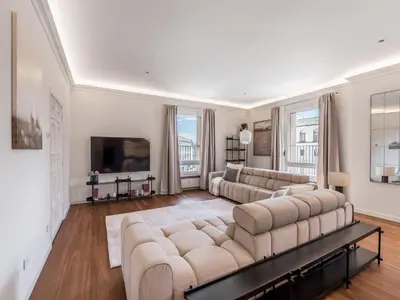 a living room with two couches and a tv at The Best Rent - Prestigious multi-bedroom apartment overlooking St. Peter’s in Rome