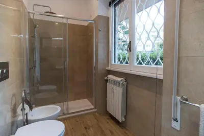 a bathroom with a shower and a toilet and a sink at Boba's House, Rome in Rome