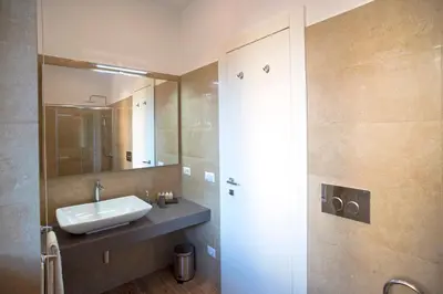 a bathroom with a sink and a mirror at Boba's House, Rome in Rome