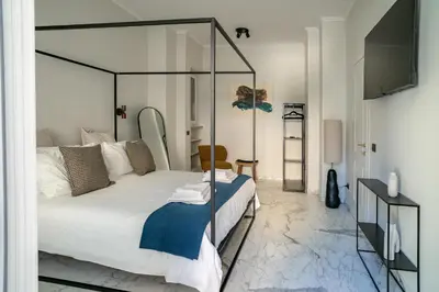 a bedroom with a bed with a glass canopy at La Terrazza di Ermini in Rome