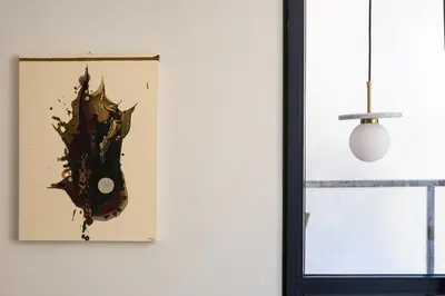 a painting on a wall next to a window at La Terrazza di Ermini in Rome