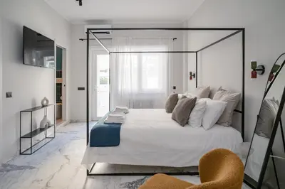a bedroom with a large bed with a glass wall at La Terrazza di Ermini in Rome