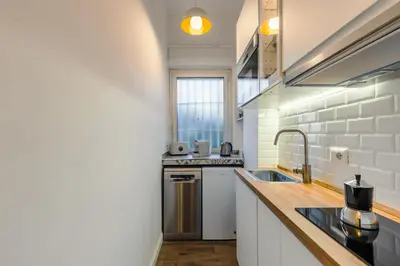 a kitchen with a sink and a counter top at Oasis house Trastevere in Rome