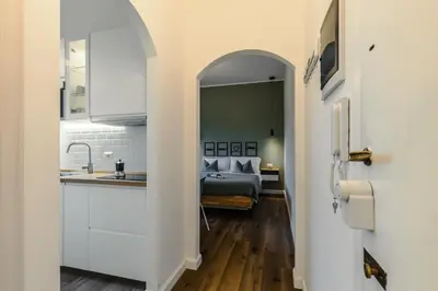 a hallway leading to a bedroom with a bed at Oasis house Trastevere in Rome