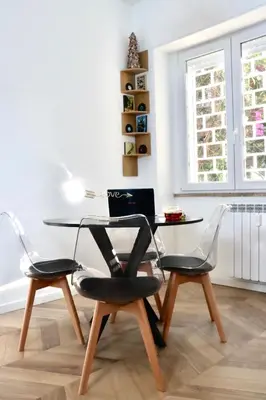 a laptop sitting on a table in a living room at Alessi Home Pigneto in Rome