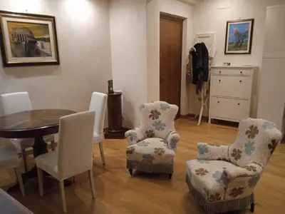 a room with a table and chairs and a table and a table and chairs at Alloggio turistico Artù in Rome