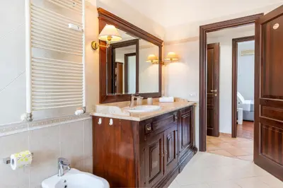 a bathroom with a sink and a mirror at Vatican Art Apartment in Rome