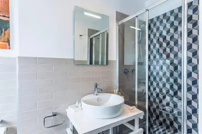 a bathroom with a sink and a shower at Double Pixel Apartments - Wonderful Stay in Rome