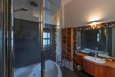 a bathroom with a tub and a sink at Villa Ada Apartment - Parioli in Rome