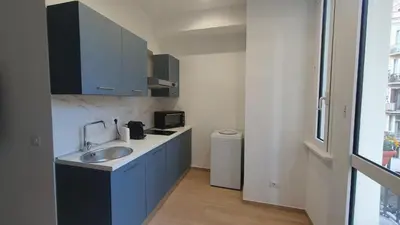 a small kitchen with a sink and a refrigerator at MariElu a Trastevere in Rome