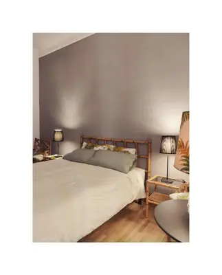 a bedroom with a large white bed and two lamps at Saint Bon Apartment Good for Families in Rome