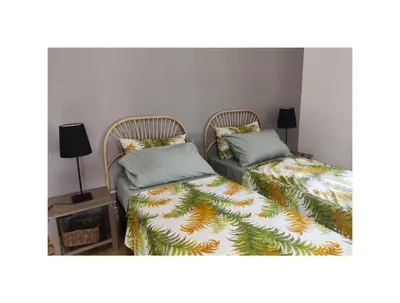 two beds sitting next to each other in a room at Saint Bon Apartment Good for Families in Rome