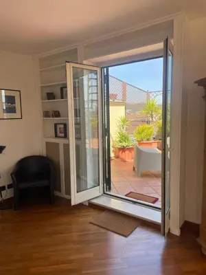 a sliding glass door in a room with a patio at La Dolce Vista in Rome