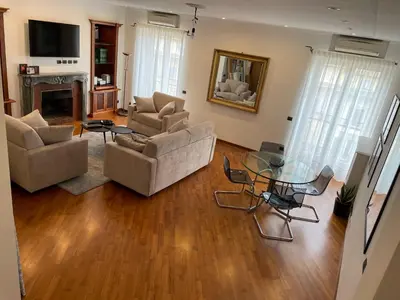 a living room with couches and a glass table at La Dolce Vista in Rome