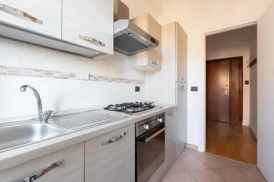 a kitchen with a sink and a stove top oven at Agostini 9- Bright Flat in Rome