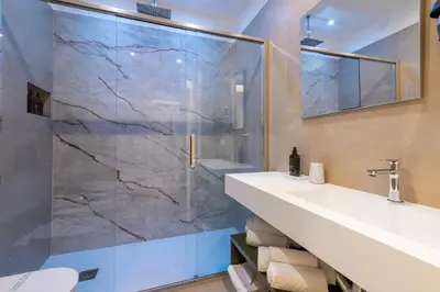 a bathroom with a sink and a shower at 69 Suite Boutique in Rome