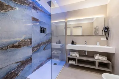 a bathroom with a sink and a mirror at 69 Suite Boutique in Rome
