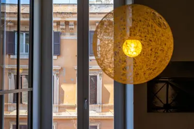 a window with a view of a building at iFlat Contemporary Design Living in Rome in Rome