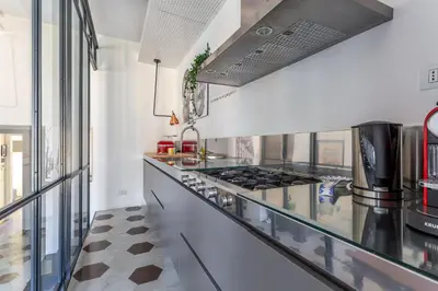 a kitchen with a counter with a stove at iFlat Contemporary Design Living in Rome in Rome