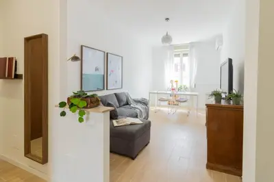 a living room with a couch and a table at Caracciolo Vatican Apartment in Rome