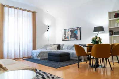 a bedroom with a bed and a television in it at Vatican Best Suite in Rome