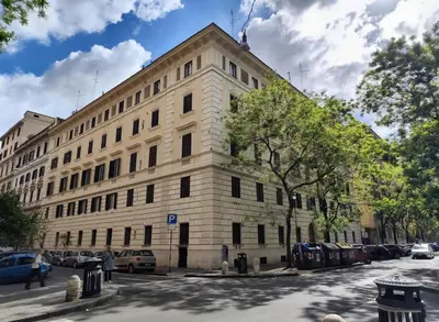 a large wooden door on the side of a building at Vatican Best Suite in Rome