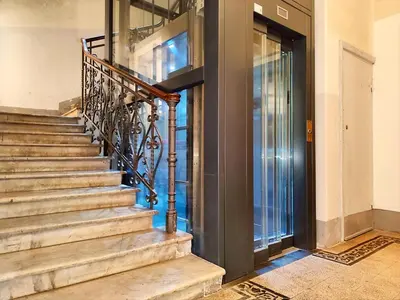 a wooden door in a room with a tile floor at Vatican Best Suite in Rome