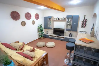a living room with a couch and a table at Domus Loft Colosseum - Rione Monti in Rome