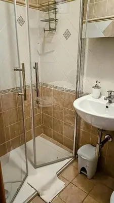 a bathroom with a shower and a sink at Little House Roma in Rome