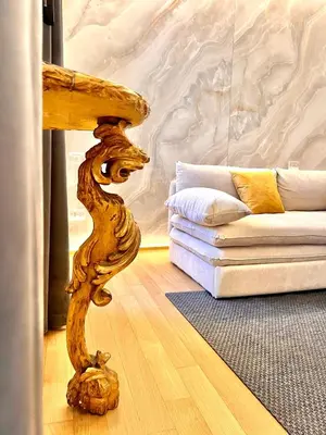 a living room with a table and a couch at Luxury Suite Monti Quirinale in Rome