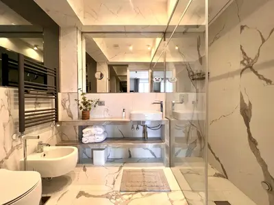 a bathroom with a sink and a toilet at Luxury Suite Monti Quirinale in Rome