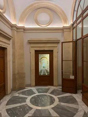 a large room with a hallway with a door and a floor at Luxury Suite Monti Quirinale in Rome