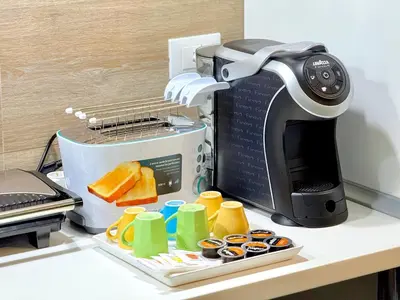 a toaster sitting on a kitchen counter with food at Turati maison d'hotes in Rome