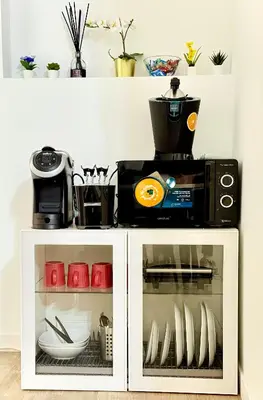 a microwave oven sitting on top of a cabinet at Turati maison d'hotes in Rome