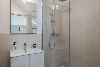 a bathroom with a shower and a sink at Turati maison d'hotes in Rome