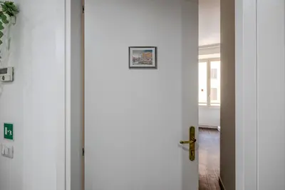a white door with a picture on it at Turati maison d'hotes in Rome