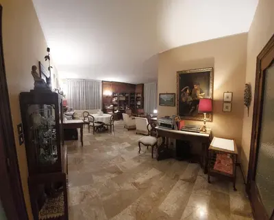 a living room with a couch and a table at La Casa Dei Nonni al Vaticano in Rome