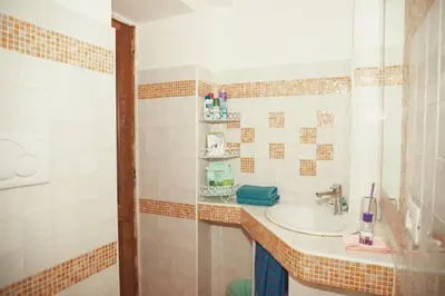 a bathroom with a sink and a mirror at La Casetta del '32 in Rome