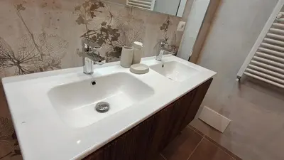a bathroom with a white sink and a mirror at La Casa Di Elda - 2 Camere - Metro B in Rome