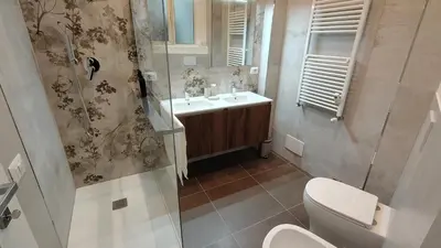 a bathroom with a toilet and a sink at La Casa Di Elda - 2 Camere - Metro B in Rome