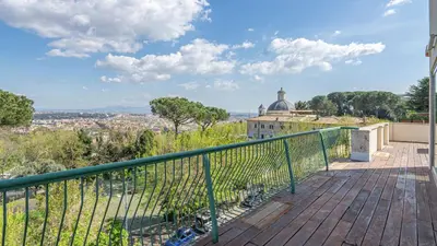 a balcony with a view of a city at EasyTopStay - Rome from above Apt with a view in Rome