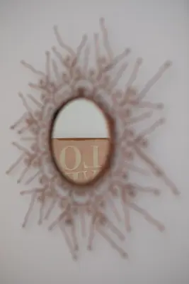 a mirror on a wall with a snowflake at RomAntica Laterano in Rome