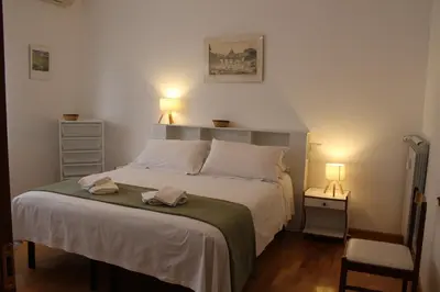 a bedroom with a bed with two towels on it at Interno 10 in Rome
